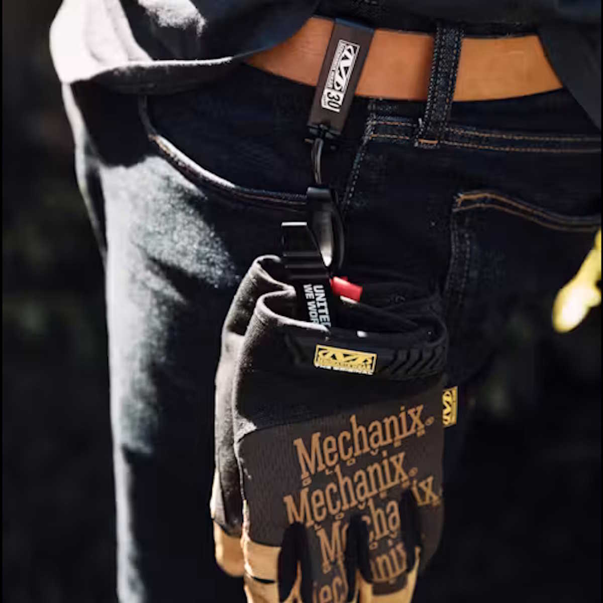 mechanix wear black belt mounted glove clip in use