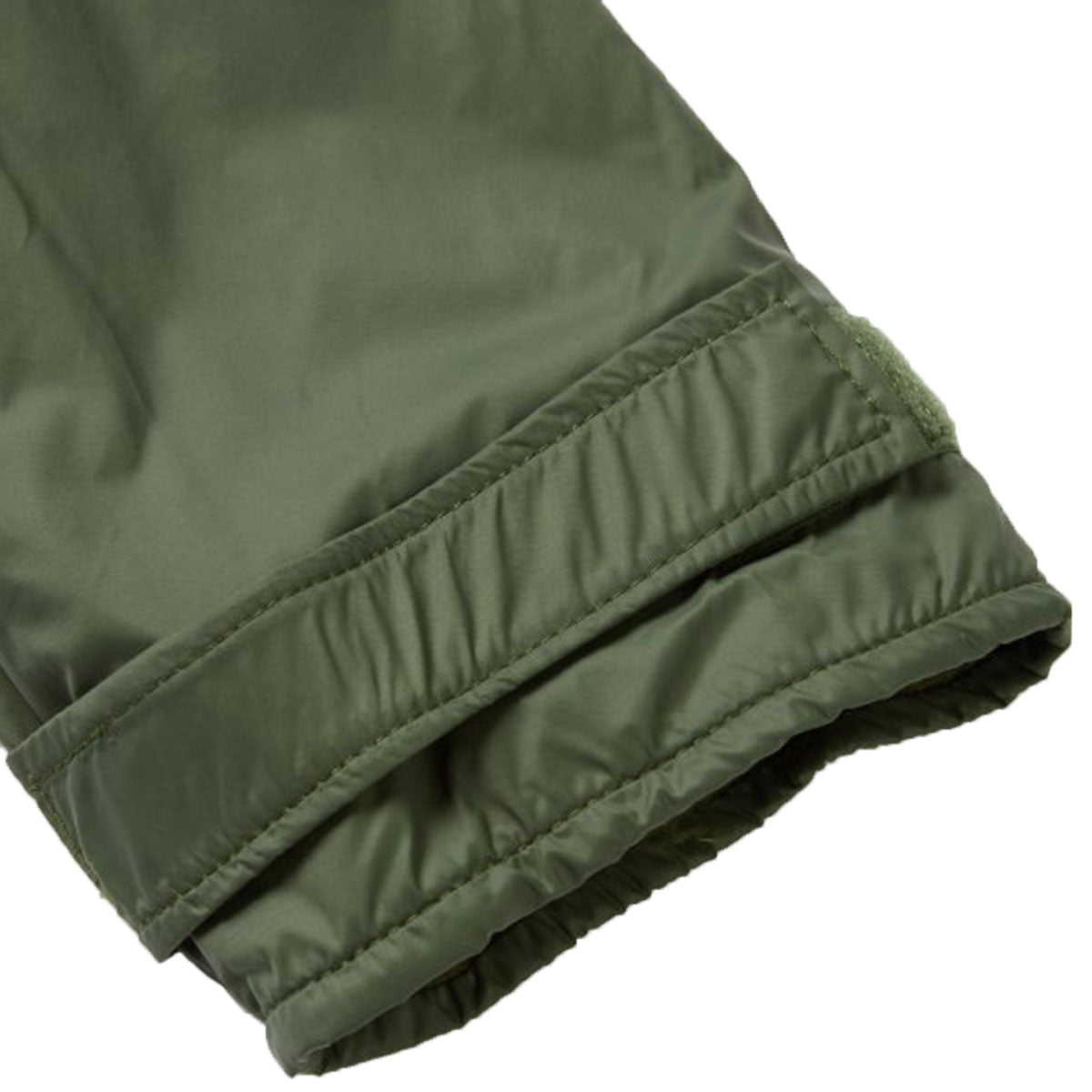 olive green buffalo systems belay jacket cuff tags