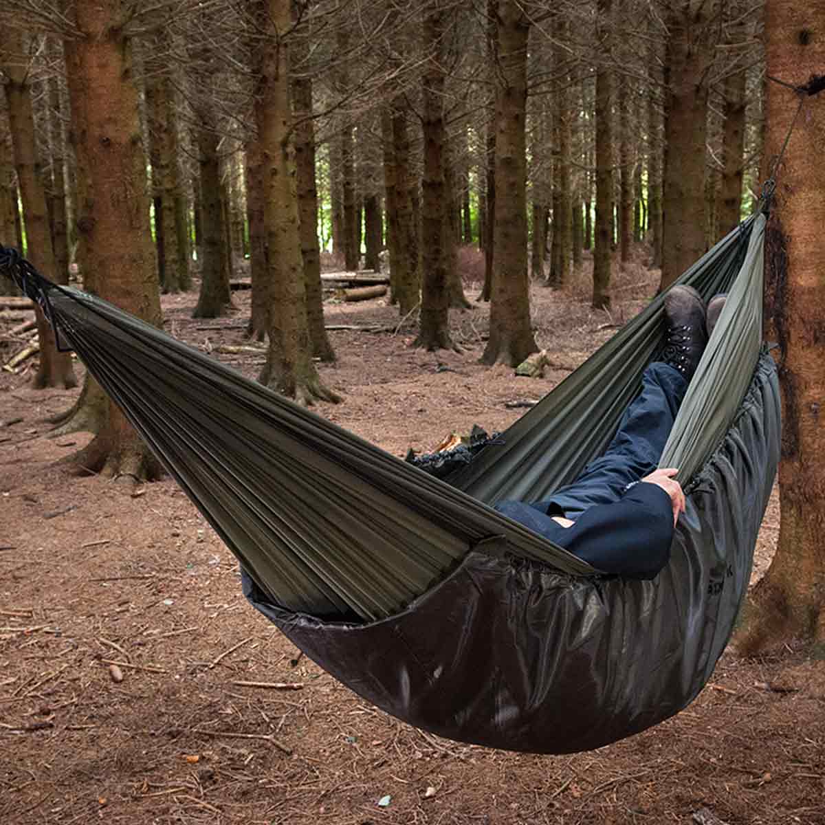 side angle of snugpak hammock olive under blanket