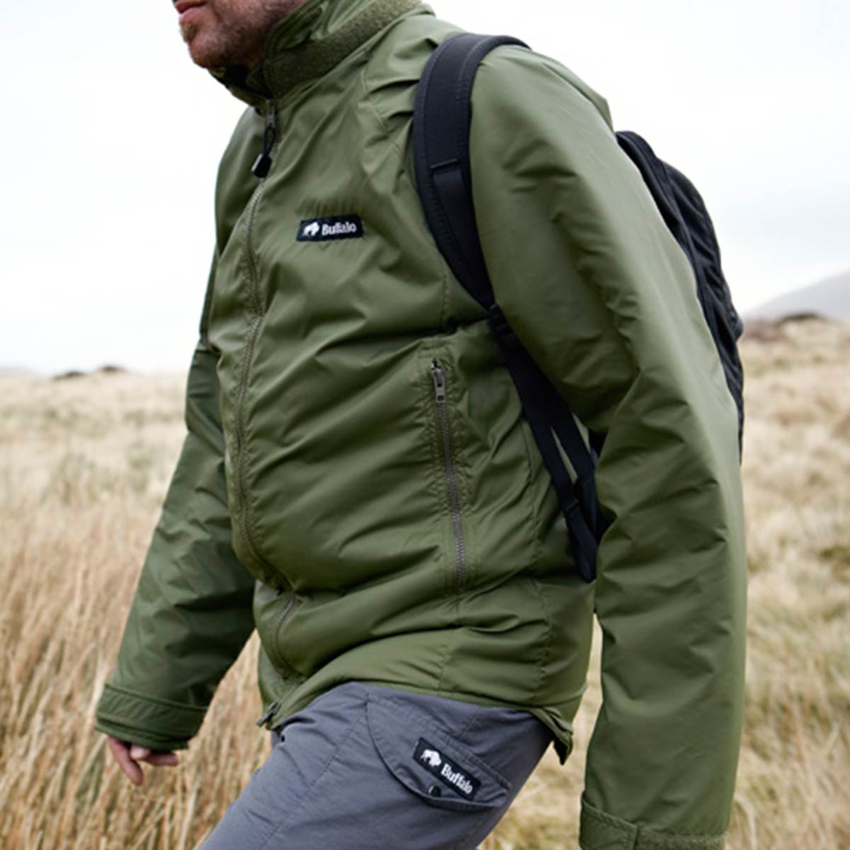 side pocket of green buffalo systems belay jacket