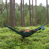 lounging on dd camping hammock in trees