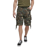 front view of model wearing brandit savage vintage shorts woodland camo