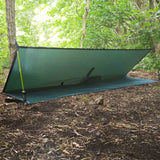 outdoor setup of dd hammocks green poncho tarp