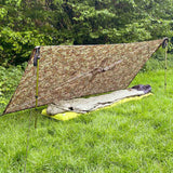 outdoor setup of dd hammocks multicam poncho tarp