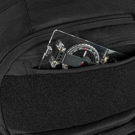 outer stash pocket of black highlander harrier full 45l clamshell pack